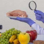 Meat and Food Quality Control Laboratory Testing with a Magnifying Glass